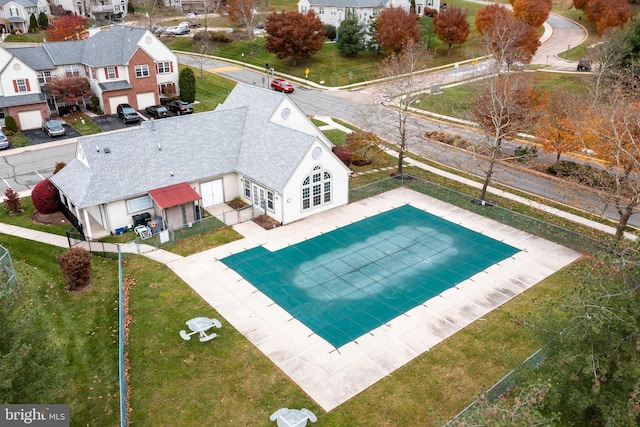 view of pool with a patio, fence private yard, and a residential view