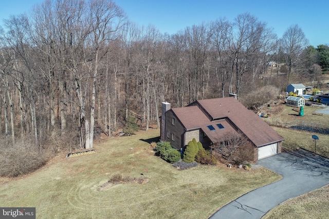 aerial view featuring a view of trees