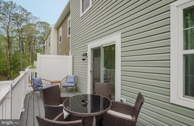 deck with outdoor dining space