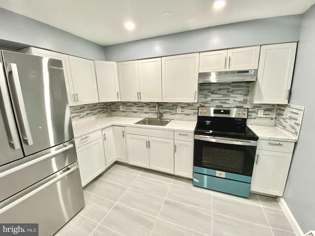 kitchen with appliances with stainless steel finishes, a sink, white cabinets, and under cabinet range hood