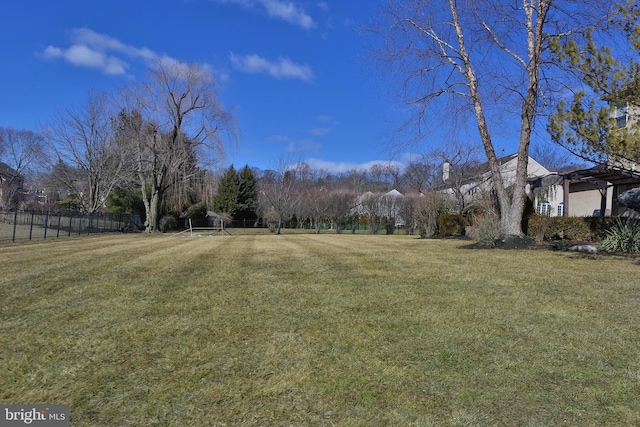 view of yard with fence and a pergola