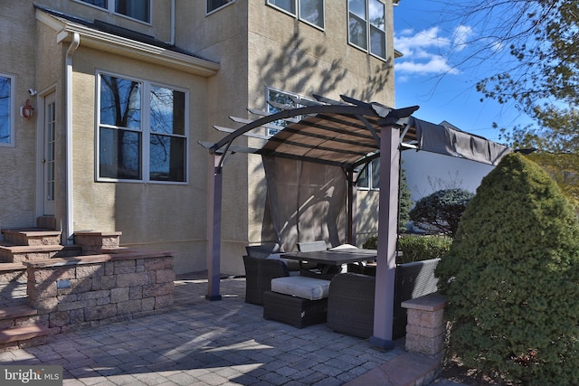 view of patio / terrace featuring outdoor dining space and a pergola