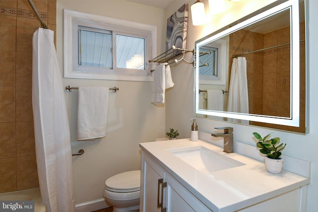 full bathroom with toilet, a shower with curtain, and vanity