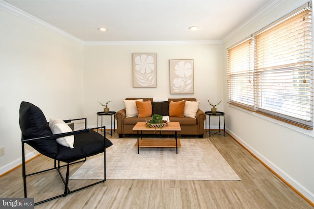 sitting room with ornamental molding, recessed lighting, wood finished floors, and baseboards