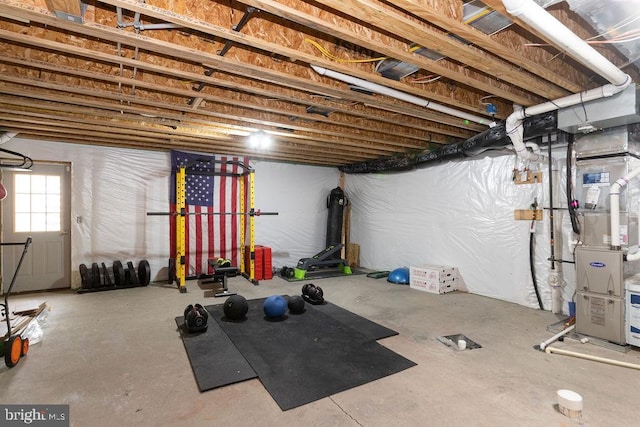 workout room featuring heating unit