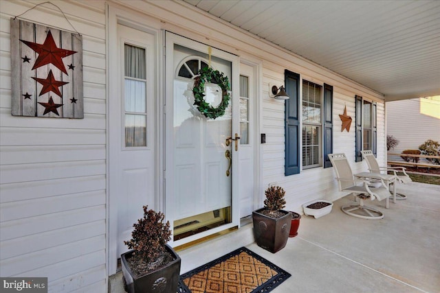 property entrance featuring covered porch