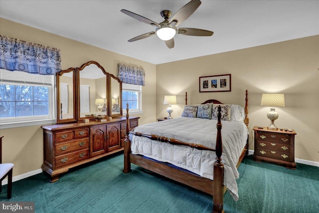 bedroom with dark colored carpet, multiple windows, and baseboards