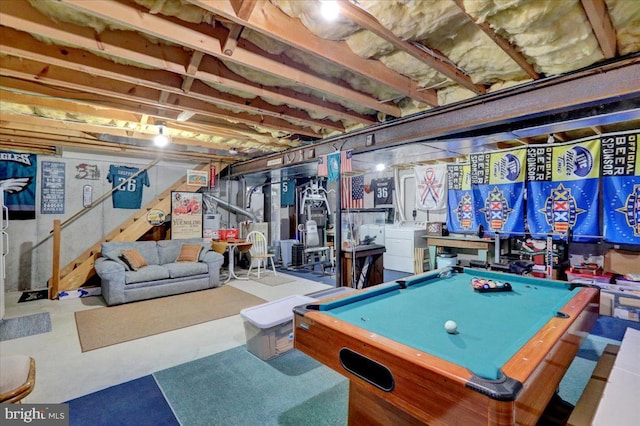 recreation room featuring washer / dryer, billiards, and concrete floors