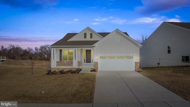 view of front of property with concrete driveway, an attached garage, board and batten siding, stone siding, and a front lawn