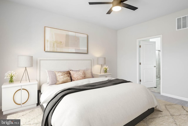 carpeted bedroom with a ceiling fan, visible vents, and baseboards