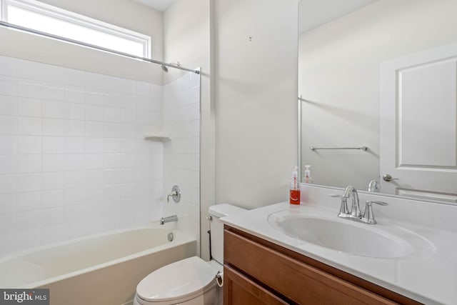 bathroom featuring shower / washtub combination, vanity, and toilet