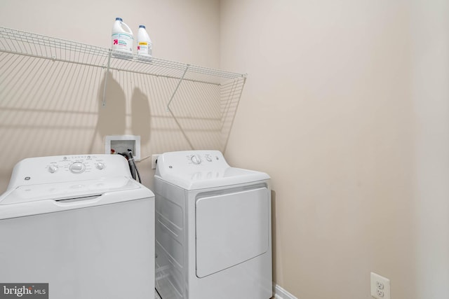 clothes washing area with laundry area and washing machine and dryer