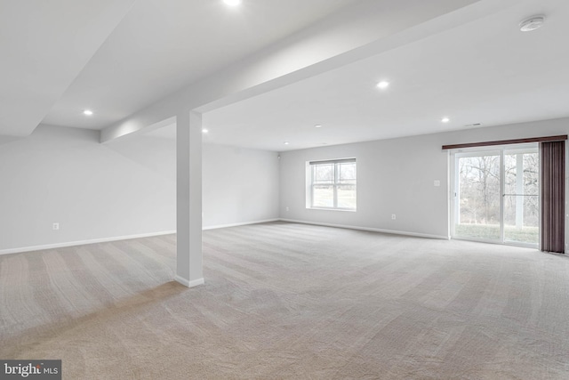 below grade area featuring carpet floors, baseboards, and recessed lighting