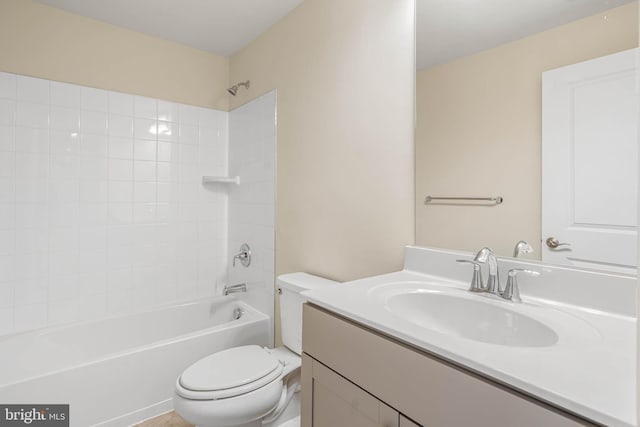 full bath featuring vanity, toilet, and shower / bathtub combination