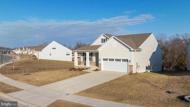 view of front of house with a shingled roof, board and batten siding, a garage, driveway, and a front lawn