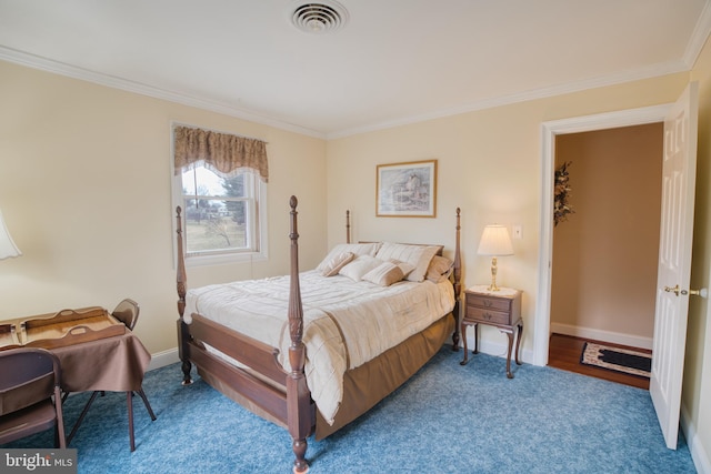 carpeted bedroom with ornamental molding, visible vents, and baseboards