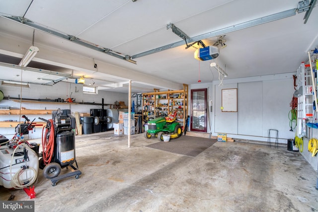 garage featuring a garage door opener