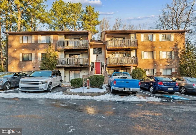 view of property featuring uncovered parking