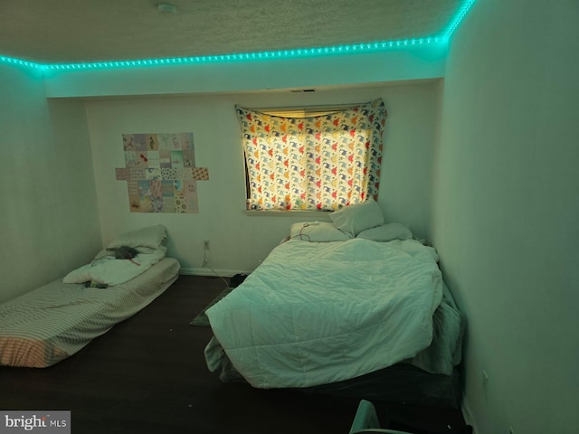 bedroom with wood finished floors