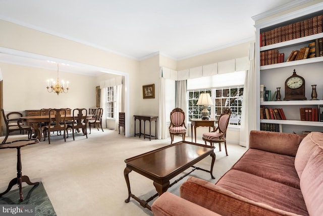 living area with a notable chandelier, carpet floors, and crown molding