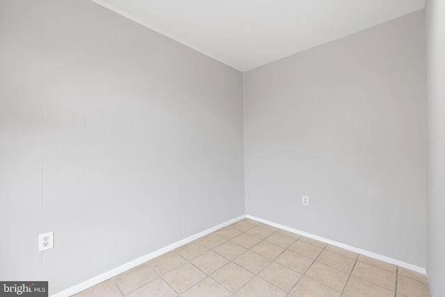 unfurnished room featuring baseboards