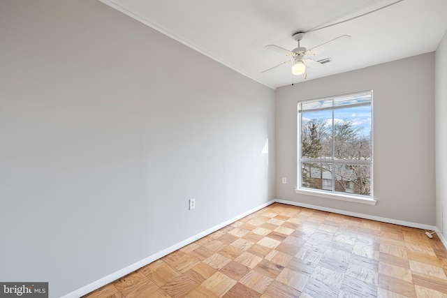 empty room featuring visible vents, baseboards, and a ceiling fan