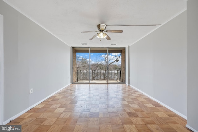 unfurnished room featuring crown molding, ceiling fan, floor to ceiling windows, and baseboards