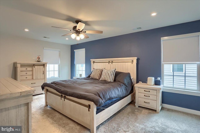 bedroom featuring baseboards, visible vents, a ceiling fan, light colored carpet, and recessed lighting