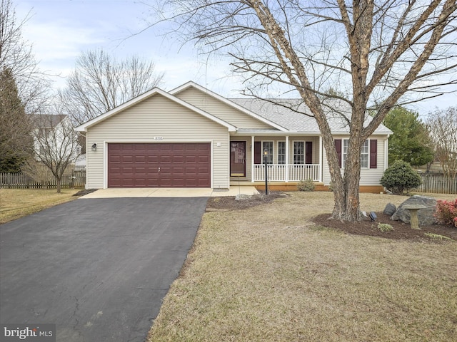 single story home with a porch, aphalt driveway, a garage, fence, and a front yard