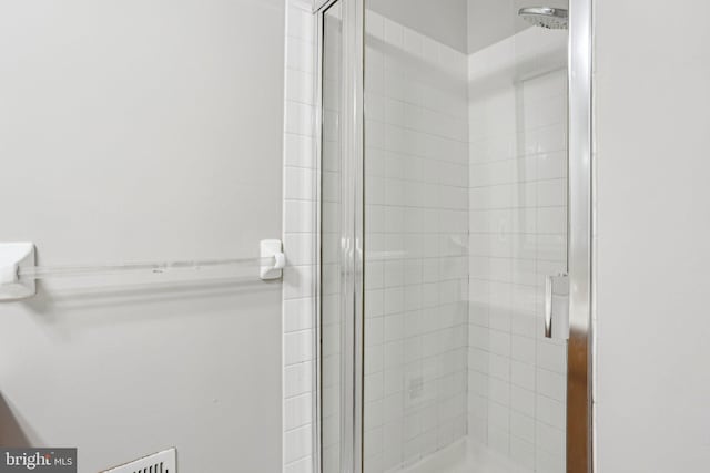 full bathroom featuring a shower stall