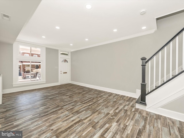 unfurnished living room featuring wood finished floors, visible vents, baseboards, recessed lighting, and crown molding