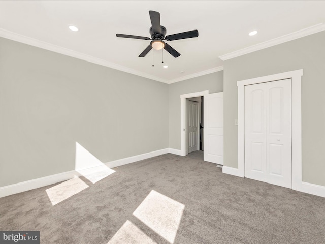 unfurnished bedroom featuring baseboards, carpet, and ornamental molding