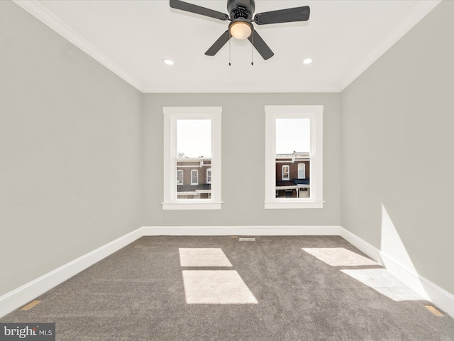 carpeted spare room featuring recessed lighting, a ceiling fan, baseboards, and ornamental molding