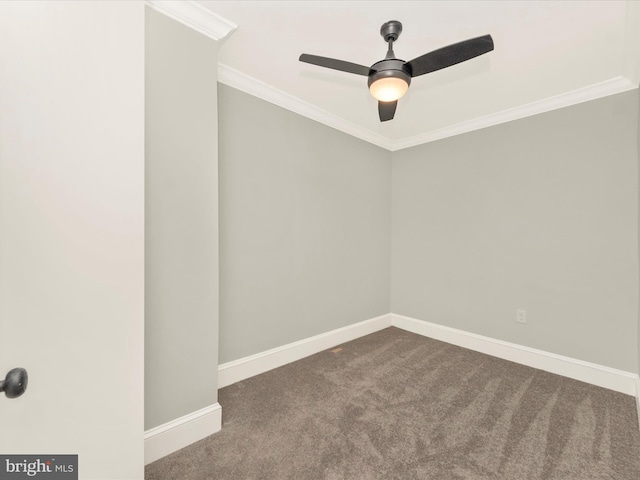 spare room with crown molding, baseboards, dark carpet, and ceiling fan