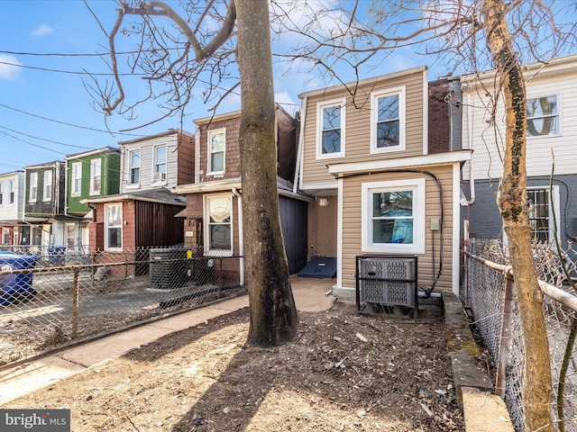 view of front of property featuring a residential view and fence private yard