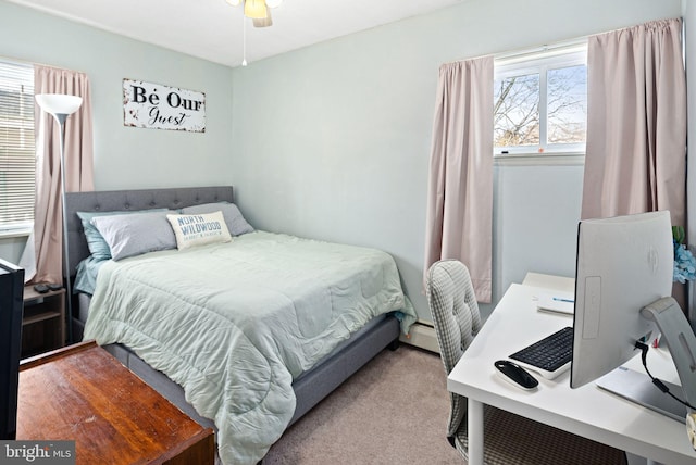 bedroom featuring a ceiling fan and light colored carpet