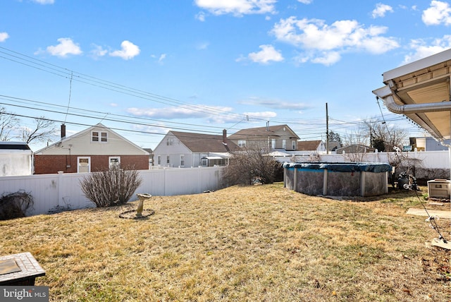 view of yard with a fenced in pool and fence private yard