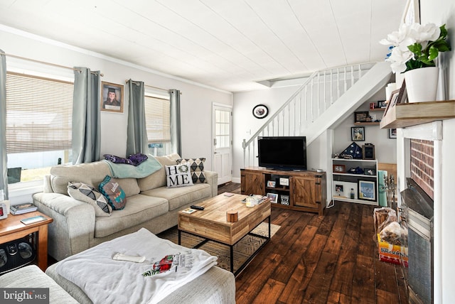 living room with stairs, dark wood-style flooring, and a fireplace