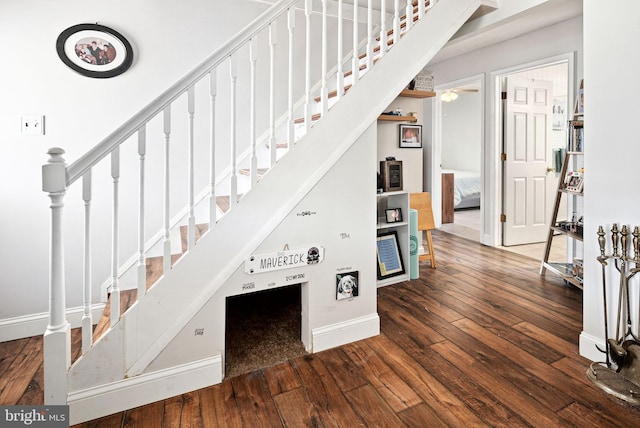 stairway with baseboards and hardwood / wood-style floors