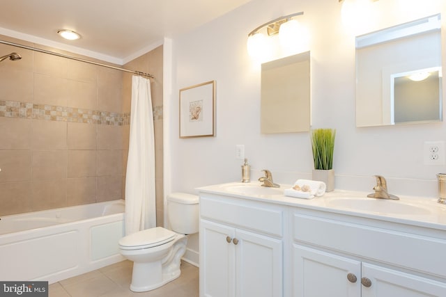 bathroom with shower / tub combo with curtain, tile patterned flooring, a sink, and toilet