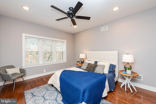 bedroom featuring baseboards, visible vents, dark wood finished floors, and recessed lighting