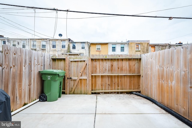 view of patio / terrace featuring a gate and fence