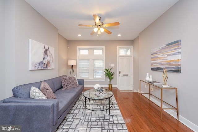 living area with recessed lighting, ceiling fan, baseboards, and wood finished floors