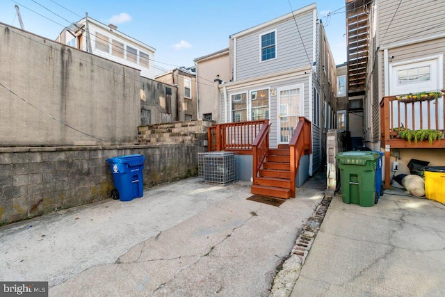 back of property featuring a patio and central AC unit