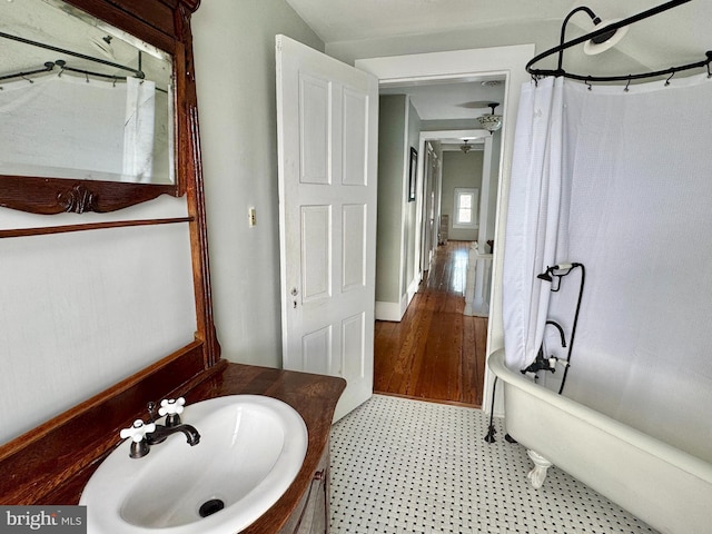 full bathroom with vanity, tile patterned floors, curtained shower, and a bath