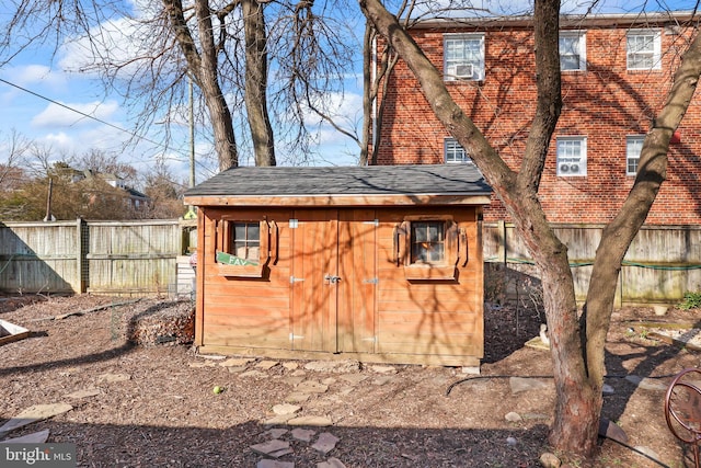 view of shed with a fenced backyard