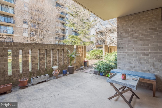 view of patio / terrace featuring fence