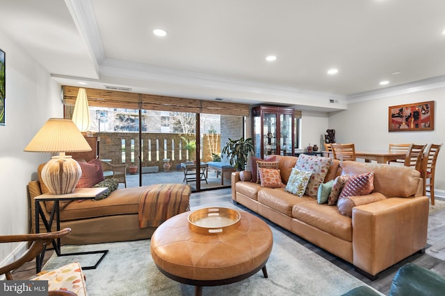 living area featuring recessed lighting, crown molding, and wood finished floors