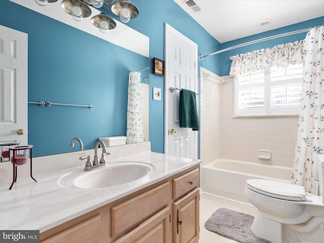 bathroom featuring shower / tub combo, visible vents, vanity, and toilet