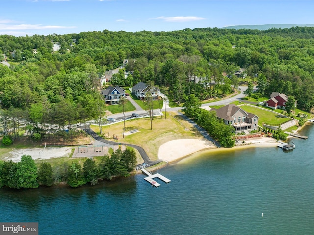 aerial view featuring a water view and a wooded view